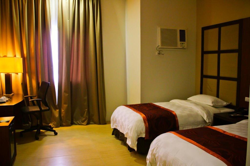 Avenue Suites Hotel And Spa Bacolod Quarto foto